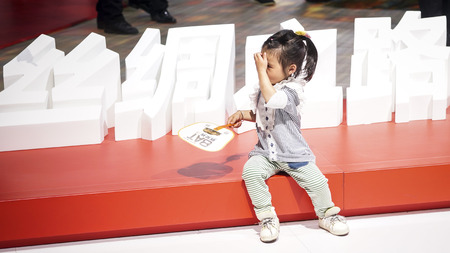 Girl holding a fanのeditorial素材