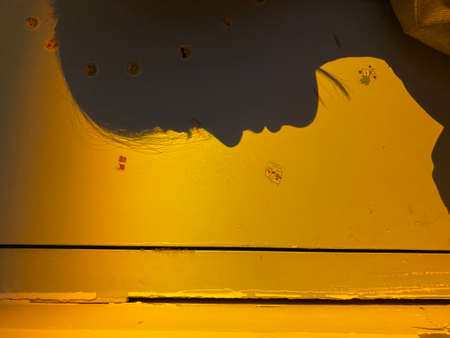 Close up view of yellow paint on the wall.の写真素材