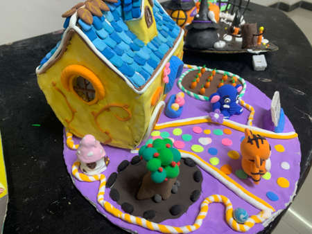 Funny gingerbread house on a black backgroundの写真素材