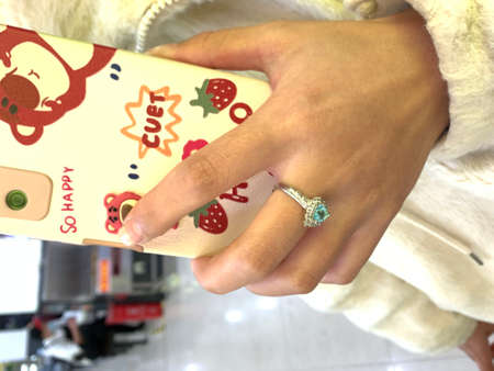 Hand holding smart phone. Selective focus.の写真素材