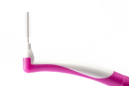 The interdental brush isolated on white backgroundの写真素材