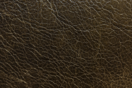 An aged brown leather texture shallow focusの写真素材