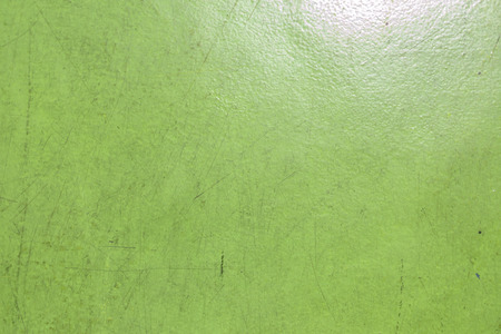A green painted with scratch texture backgroundの写真素材