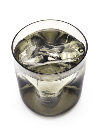 A brown transparency modern glass fill with fresh ice and water isolated on white backgroundの写真素材