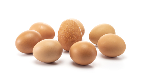 A group of eggs surroundding to one egg with sweat isolated on white backgroundの写真素材