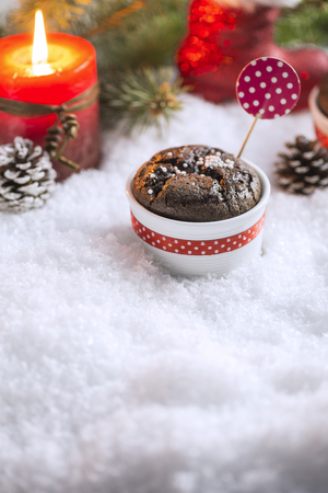 Chocolate Cupcake with Snowflakes, Candle and Christmas Treeの写真素材