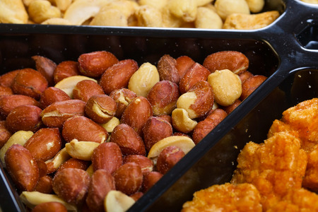 Peanuts or arachis in black can
