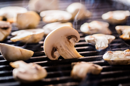 Champignon mushrooms on grill