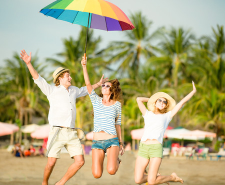 Group of happy young people having fun on the beachの写真素材
