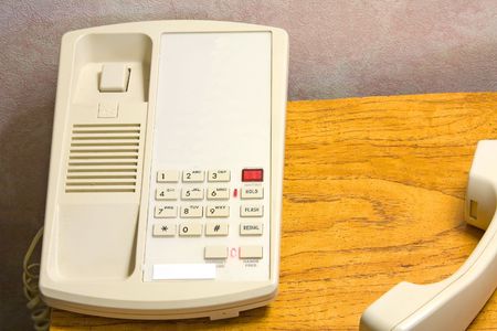 telephone in a hotel room sitting on a night stand