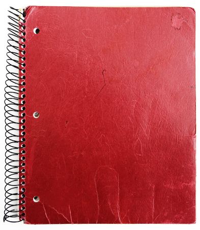 old red notebook isolated against white backgroundの写真素材