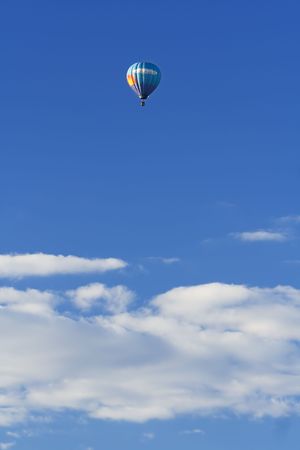 hot air balloon high in the skyの写真素材