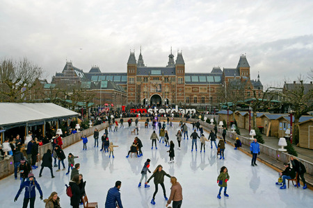Panorama of the ice rink during the winter at Museumplein. In the background you can see the Rijksmuseum with words I Amsterdam, Amsterdam. Netherlandsのeditorial素材