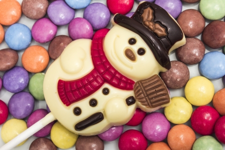 White Chocolate Snowman on Candy Backgroundの写真素材