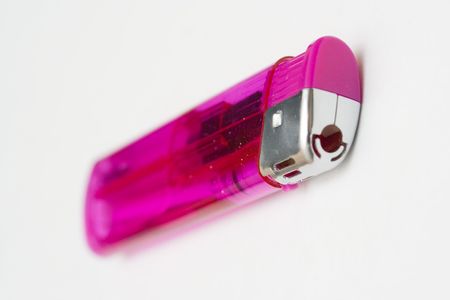 Purple cigarette lighter isolated over white backgroundの写真素材