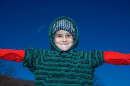 Portrait of a beautiful child outdoor, in a sunny spring day