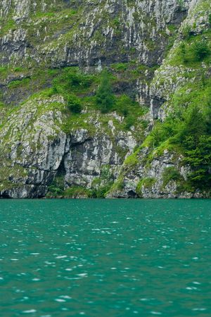 Lake and forest in a mountain sceneryの写真素材