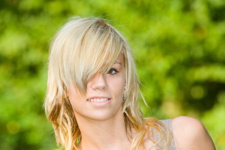Beautiful young blonde having good time outdoorsの写真素材
