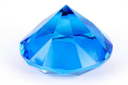 Blue glass polyhedron toy isolated on white backgroundの写真素材
