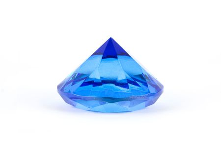 Blue glass polyhedron toy isolated on white backgroundの写真素材