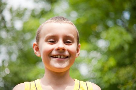 Cute kid having fun outdoorsの写真素材