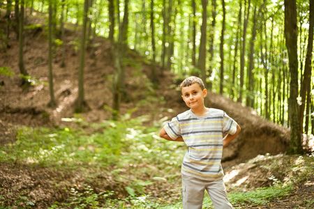 Cute kid outdoor in a forestの写真素材