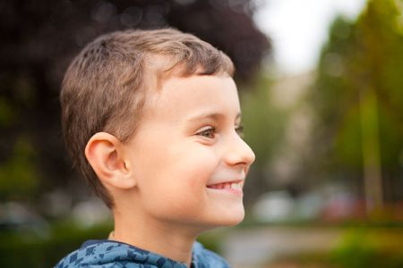 Close-up portrait of a beautiful child outdoorの写真素材