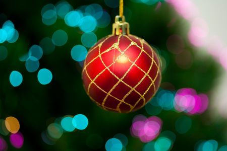 Red Christmas ball with beautiful bokeh lights in the backgroundの写真素材