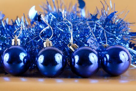 Blue Christmas decorations on golden shiny backgroundの写真素材