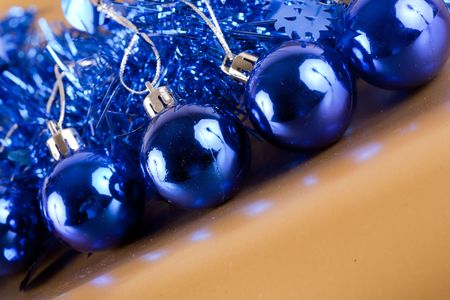 Blue Christmas decorations on golden shiny backgroundの写真素材