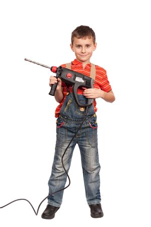 Cute kid as a construction worker with drilling machineの写真素材