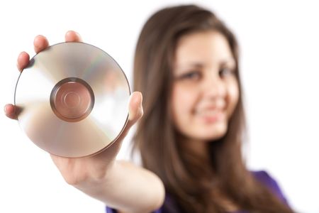 Woman holding a cd or dvd, isolated on whiteの写真素材