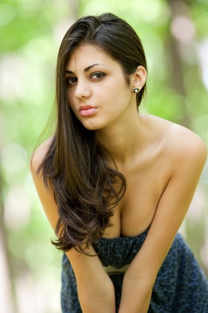 Portrait of a beautiful latin young lady outdoorsの写真素材