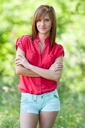 Portrait of a beautiful blonde young woman outdoorの写真素材
