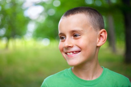 Close up portrait of a happy child outdoorの写真素材