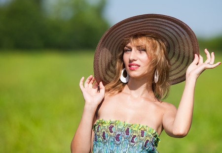 Beautiful young woman with colorful dress outdoorの写真素材