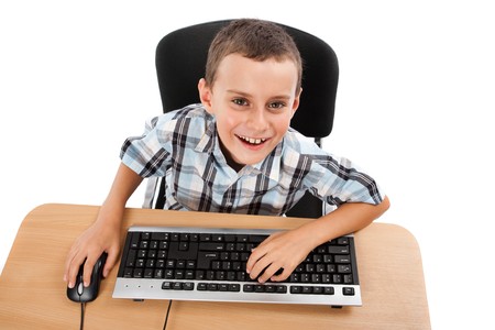 Cute schoolboy using keyboard and mouse, isolated on white background