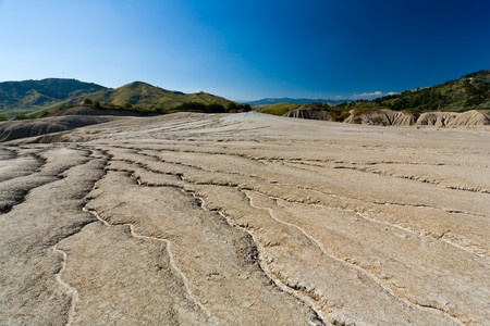 Landscape with cracked soil from Muddy Volcanoes, at Berca, Romaniaの写真素材
