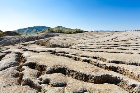 Landscape with cracked soil from muddy volcanoes at Berca, Romaniaの写真素材