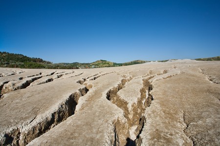 Landscape with cracked soil from muddy volcanoes at Berca, Romaniaの写真素材
