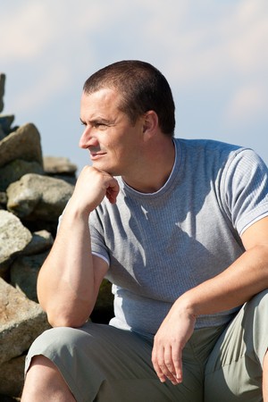 Portrait of a young man outdoor with sky in the backgroundの写真素材