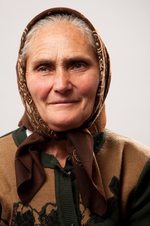 Portrait of a happy old woman isolated on white