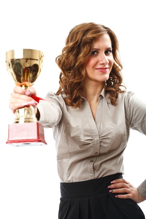 Portrait of a young businesswoman holding a golden cup, symbol of success in businessの写真素材