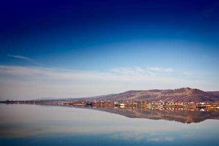 Houses from a village by a lakeの写真素材