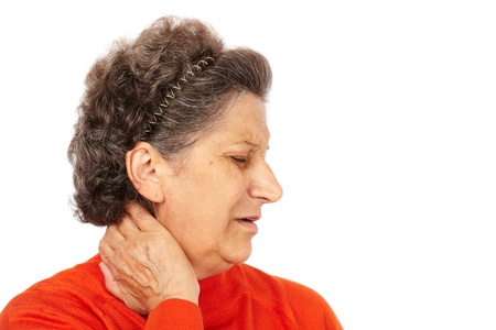 Senior woman with back neck pain isolated on white backgroundの写真素材