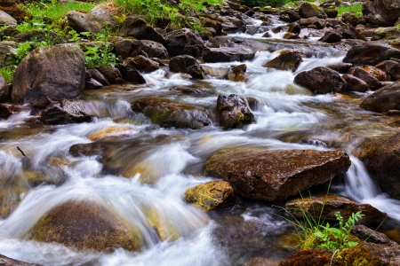 Landscape with river flowing through rocks