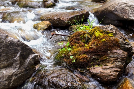 Landscape with river flowing through rocksの写真素材