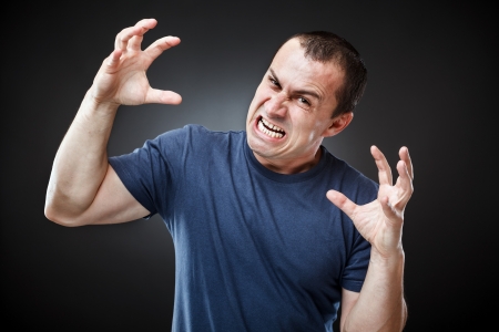 Portrait of an extremely angry young man の写真素材