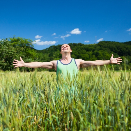 Young farmer outdoor in the wheat fieldの写真素材