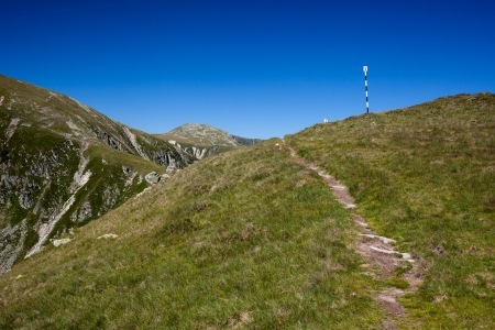 Trail with pole marks in the mountainsの写真素材